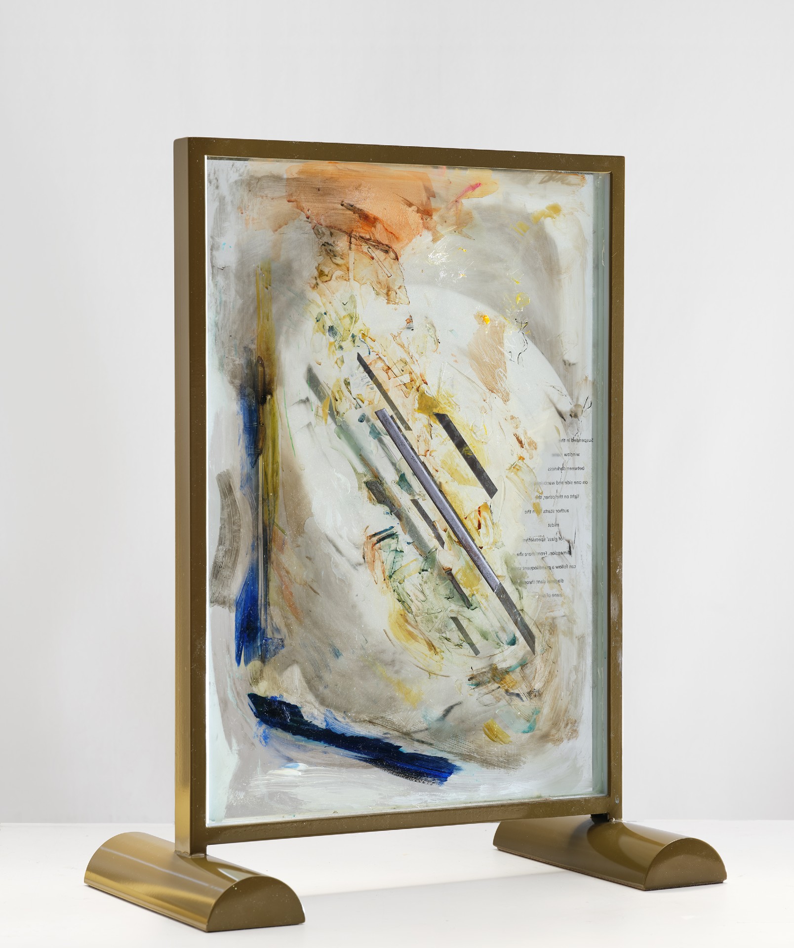 *"In America" Piece (For Susan Sontag),* 2025; lead and paint and printed text on glass, metal armature; 30x24x12 inches. 

Photography by Brica Wilcox. Framing thanks to Nick Rodrigues.