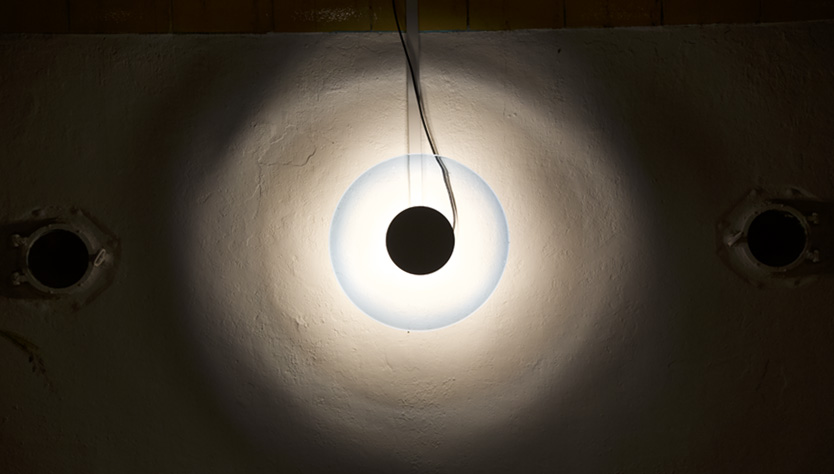 The Diver,2018, milk paint, glass (rondels), borosilicate, wood, concrete, dirt, light fixture, TARP, Altadena, CA. Rondel by Max Grossman, KT Glassworks. Metalwork by Charles Mathis