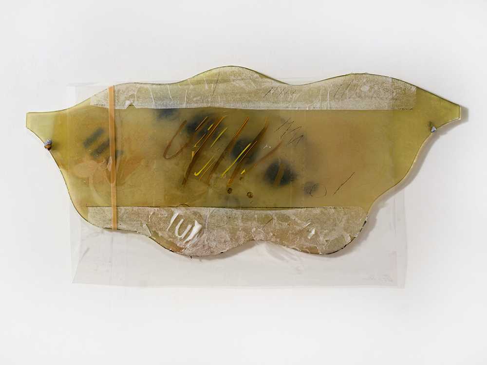 *Also Bathroom Mirror Piece*, 2024; burnt bathroom mirror, paper, paint, plastic, lead, rubber band; 17 x 32 x 1". Photography by Brica Wilcox. 
